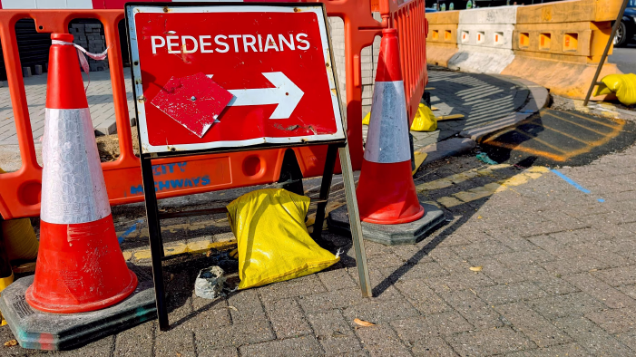 Pedestrian sign and street barriers
