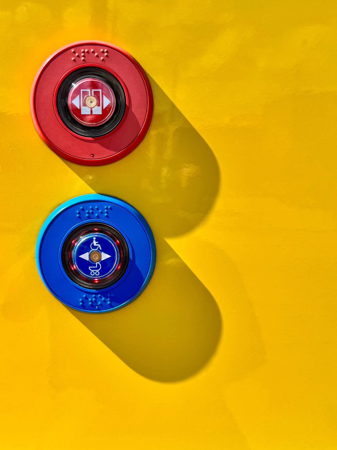 Emergency buttons on yellow wall
